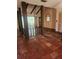 Cozy living room featuring a vaulted ceiling, exposed beams, and tile flooring at 1862 Orangewood Ln, Sarasota, FL 34232