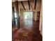 Spacious living room with a vaulted ceiling, exposed beams, and sliding glass doors at 1862 Orangewood Ln, Sarasota, FL 34232