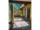 Private patio space with a glass table that provides a quiet outdoor retreat at 1862 Orangewood Ln, Sarasota, FL 34232