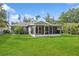 A well-maintained backyard offers plenty of space for outdoor enjoyment and features a screened-in lanai at 2039 Kai Dr, Sarasota, FL 34231