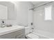 Clean bathroom featuring a modern vanity, updated fixtures, and a shower-tub combination for relaxation at 2039 Kai Dr, Sarasota, FL 34231