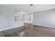 Bright and airy living room with sleek gray flooring and neutral paint at 2039 Kai Dr, Sarasota, FL 34231
