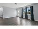 Inviting living room featuring gray floors, and a decorative front door at 2039 Kai Dr, Sarasota, FL 34231