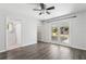 Spacious main bedroom with a ceiling fan and access to a screened-in patio at 2039 Kai Dr, Sarasota, FL 34231