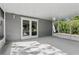 Enclosed patio perfect for enjoying outdoor space with French doors and screened walls at 2039 Kai Dr, Sarasota, FL 34231
