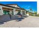 Exterior of the community clubhouse, featuring a welcoming entrance and outdoor seating at 2045 Gulf Of Mexico Dr # M1-310, Longboat Key, FL 34228