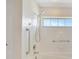 Bright bathroom features a tub, shower, and grab bars for assistance at 2407 Waterford Ct, Palmetto, FL 34221