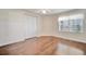 Bright bedroom features hardwood flooring and a double door closet at 2407 Waterford Ct, Palmetto, FL 34221