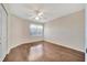 Bright bedroom featuring hardwood flooring and a ceiling fan at 2407 Waterford Ct, Palmetto, FL 34221