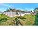 Exterior view of a home with a well-maintained lawn and mature trees at 2407 Waterford Ct, Palmetto, FL 34221