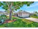 Attractive home with mature trees and a well-manicured lawn at 2407 Waterford Ct, Palmetto, FL 34221