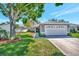 Inviting single-story home with a pristine lawn and attached garage at 2407 Waterford Ct, Palmetto, FL 34221