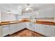 Bright kitchen features white cabinets, wood countertops and stainless steel appliances at 2407 Waterford Ct, Palmetto, FL 34221