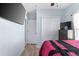 Cozy bedroom featuring a mounted TV, closet, and neutral-toned walls at 2408 28Th E Ave, Palmetto, FL 34221