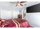 Spacious bedroom with a large bed, TV, and convenient access to the ensuite bathroom at 2408 28Th E Ave, Palmetto, FL 34221
