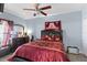 Inviting bedroom featuring a comfortable bed, wood accents, and soft lighting at 2408 28Th E Ave, Palmetto, FL 34221