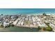 Aerial view of a vibrant coastal community near a serene waterfront at 2601 Gulf N Dr # 214, Bradenton Beach, FL 34217