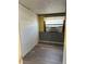 Bedroom showcasing neutral walls, ceiling fan, and wood look flooring at 2601 Gulf N Dr # 214, Bradenton Beach, FL 34217