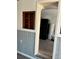 Kitchen view, showcasing neutral walls, wood look floors, and built in cabinet at 2601 Gulf N Dr # 214, Bradenton Beach, FL 34217