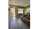 Inviting living room featuring neutral walls and wood look flooring at 2601 Gulf N Dr # 214, Bradenton Beach, FL 34217