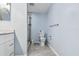 Spacious bathroom with white cabinets, shower, toilet, light blue walls and tile floors at 2625 Terra Ceia Bay Blvd # 506, Palmetto, FL 34221