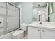 Bathroom with toilet, tub and shower combination with sliding glass door, and vanity with modern faucet at 2625 Terra Ceia Bay Blvd # 506, Palmetto, FL 34221