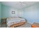 Bedroom featuring ceiling fan, picture frame, light blue paint, and queen-sized bed at 2625 Terra Ceia Bay Blvd # 506, Palmetto, FL 34221