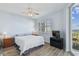 Cozy bedroom with a ceiling fan, wood floors and views of the water at 2625 Terra Ceia Bay Blvd # 506, Palmetto, FL 34221
