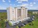Waterfront condominium complex with covered parking, lush surroundings, and picturesque water views at 2625 Terra Ceia Bay Blvd # 506, Palmetto, FL 34221