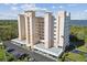 Exterior view of high-rise building with covered parking at 2625 Terra Ceia Bay Blvd # 506, Palmetto, FL 34221