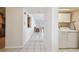 Hallway view with tile flooring, washer and dryer and access to living areas at 2625 Terra Ceia Bay Blvd # 506, Palmetto, FL 34221