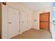 Well-maintained hallway featuring multiple storage and exterior access doors at 2625 Terra Ceia Bay Blvd # 506, Palmetto, FL 34221
