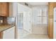 Clean kitchen with white appliances, wooden cabinets, and a view into the hall at 2625 Terra Ceia Bay Blvd # 506, Palmetto, FL 34221