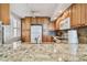 Charming kitchen with granite countertops, wood cabinetry and a ceiling fan at 2625 Terra Ceia Bay Blvd # 506, Palmetto, FL 34221