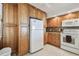 Inviting kitchen featuring wooden cabinets and white appliances at 2625 Terra Ceia Bay Blvd # 506, Palmetto, FL 34221