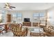 Spacious living room with wood dining table, ceiling fan and comfortable seating arrangement at 2625 Terra Ceia Bay Blvd # 506, Palmetto, FL 34221