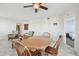 Bright living room features wood dining table, ceiling fan, tile floor and comfortable seating at 2625 Terra Ceia Bay Blvd # 506, Palmetto, FL 34221