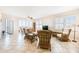Spacious living room features tiled floors, plenty of seating and access to a balcony at 2625 Terra Ceia Bay Blvd # 506, Palmetto, FL 34221