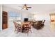 Bright and airy living room features tiled floors, ceiling fan and dining table with seating for six at 2625 Terra Ceia Bay Blvd # 506, Palmetto, FL 34221