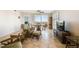 Spacious living room with tiled floors, ceiling fan, balcony access and comfortable seating at 2625 Terra Ceia Bay Blvd # 506, Palmetto, FL 34221