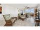 Bright living room features tile flooring, comfortable seating and access to balcony at 2625 Terra Ceia Bay Blvd # 506, Palmetto, FL 34221