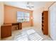 Office with window with shutters, ceiling fan, tile flooring, bookshelf, and desk at 2625 Terra Ceia Bay Blvd # 506, Palmetto, FL 34221