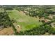 Expansive 26.9-acre parcel featuring a barndominium and multiple ponds surrounded by lush greenery at 28120 63Rd E Ave, Myakka City, FL 34251