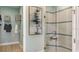 Modern bathroom featuring a tiled walk-in shower, a linen closet, and spa-like finishes at 3169 Alba Cir, Bradenton, FL 34211