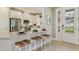 Modern kitchen with stainless steel appliances, granite countertops, and a breakfast bar with seating at 3169 Alba Cir, Bradenton, FL 34211