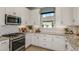 Well-appointed kitchen features stainless steel appliances, granite countertops, and ample cabinet space at 3169 Alba Cir, Bradenton, FL 34211