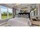 Bright and airy main bedroom with large windows, pendant lights, and a luxurious feel at 3169 Alba Cir, Bradenton, FL 34211