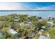 Stunning aerial view of a waterfront property with lush landscaping and scenic water views of the bay at 3304 7Th Street W Ct, Palmetto, FL 34221