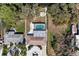 An aerial view looking straight down shows the property layout with a pool, outdoor fire pit, and circular driveway at 3304 7Th Street W Ct, Palmetto, FL 34221