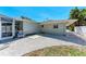 This backyard features a patio with white rock landscaping, a seating area and a fenced in area at 3304 7Th Street W Ct, Palmetto, FL 34221